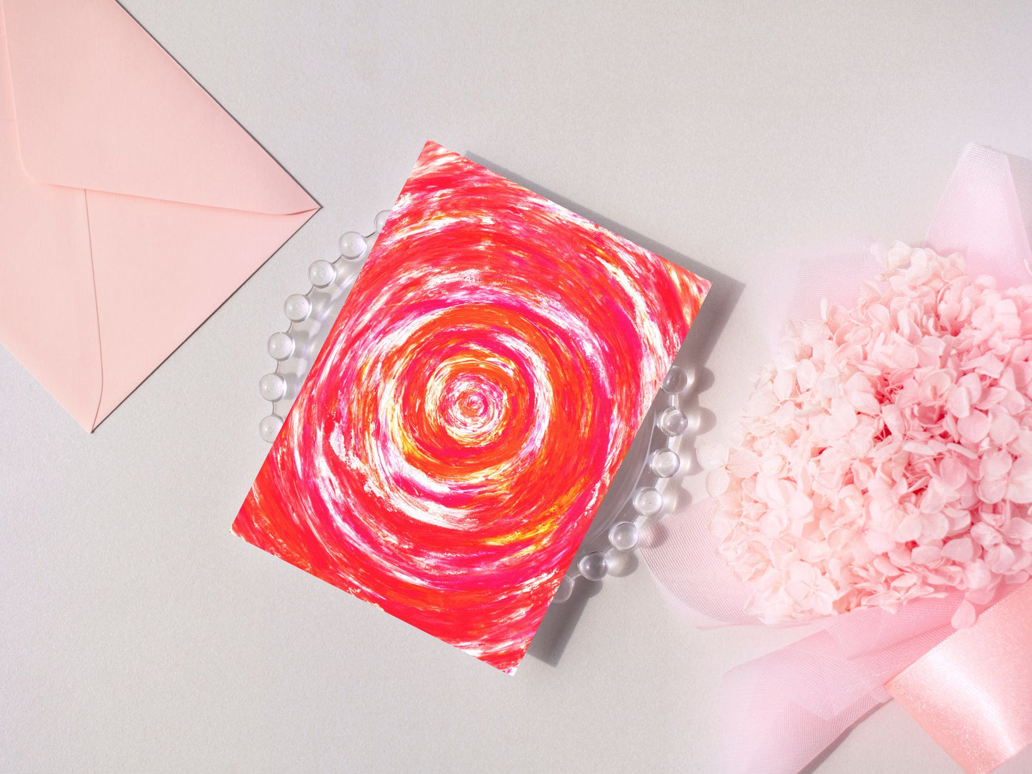 Carte de vœux avec design artistique en bleu clair, parfaite pour les fêtes.